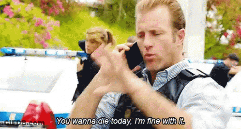 Police Officer Talking On Cell Phone In Front Of Police Car And Woman GIF