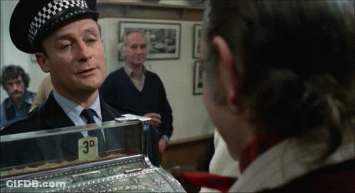 Police Officer Talking To Man In Front Of 3D Machine GIF