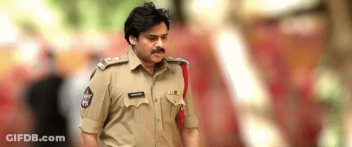 Police Officer With Mustache Walking Down Street GIF