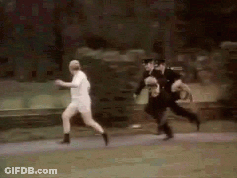 Police Officers Chasing Man In White Shirt GIF