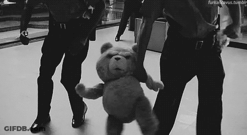 Police Officers Holding Teddy Bear GIF