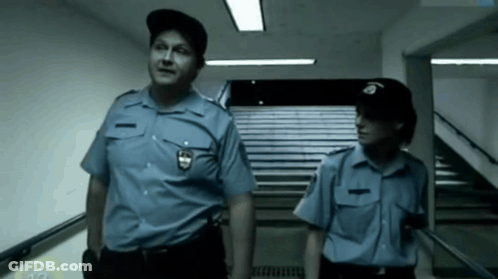 Police Officers In Front Of Champions League Building GIF