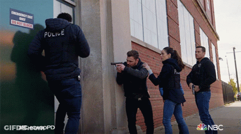 Police Officers In Front Of Emergency Do Not Block Sign GIF