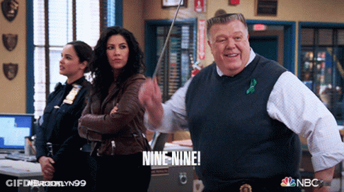 Police Officers Standing In Room Saying Nine Nine GIF