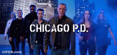 Police Officers Standing Next To Each Other City Skyline GIF