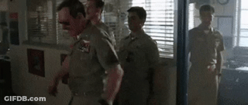 Police Officers Walking Through Doorway GIF