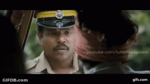 Police Uniform Man Talking To Another Man With YouTube.com/Tutormalayalam GIF
