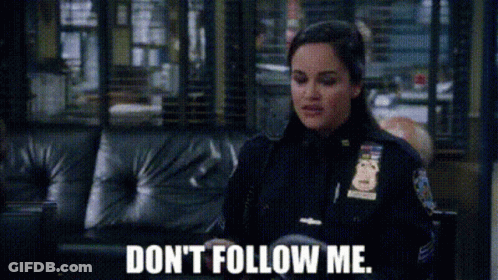Police Woman Sitting On Couch Don't Follow Me GIF