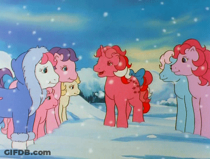 Ponies Standing In Snow With Bow On Tail GIF