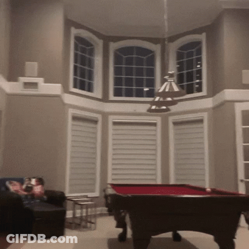 Pool Table In Living Room With Large Window GIF