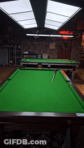 Pool Tables In Room With A & R Sign GIF
