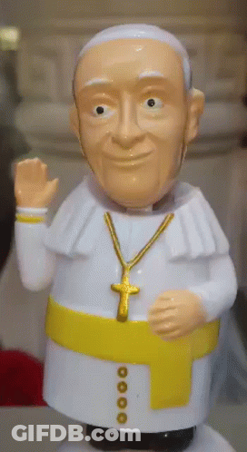 Pope Figurine In White Robe And Gold Cross GIF