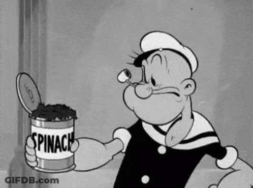Popeye Is Holding A Can Of Spinach In His Hand . GIF