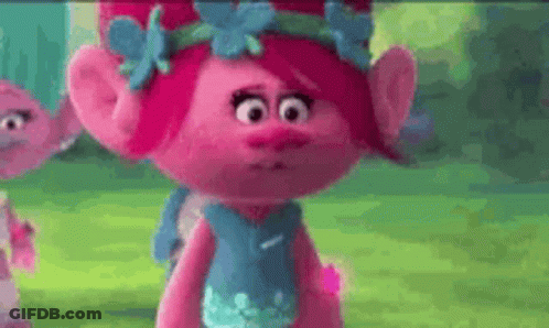 Poppy From Trolls Is Wearing A Blue Dress With Flowers On It . GIF