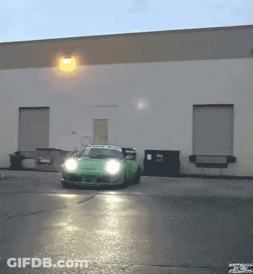 Porsche 911 Green Making A Curve GIF