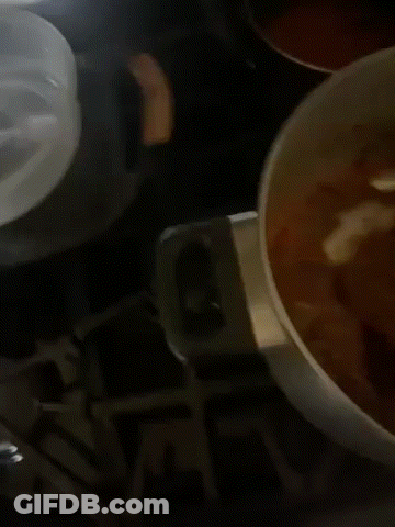 Pot Of Soup With Pink Spoon GIF