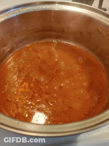 Pot Of Tomato Sauce On Stove GIF
