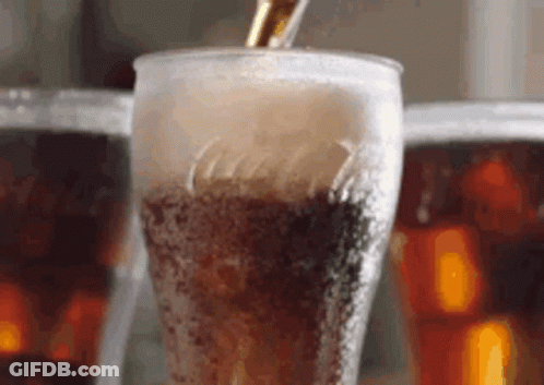 Pouring Cola Into Glass With Ice GIF