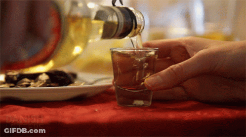 Pouring Drink From Bottle With Danish Letters GIF