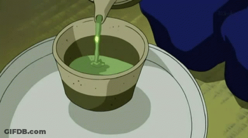 Pouring Green Liquid Into Small Cup GIF