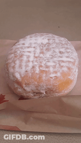 Powdered Sugar Donut On Paper With Red Star GIF