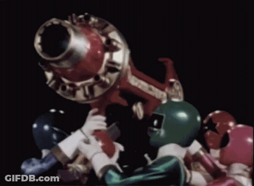 Power Rangers Standing Around Cannon In Dark Room GIF