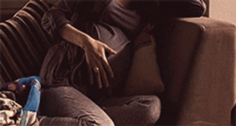 Pregnancy Woman Belly Pain Couch GIF