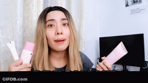 Pregnant Woman Holding Lotion GIF