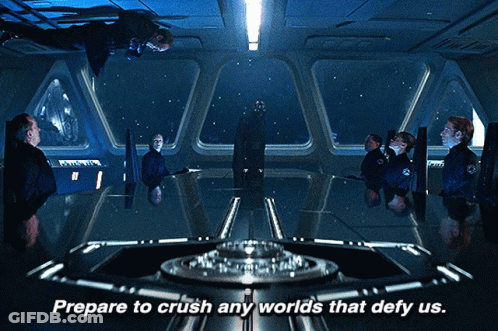 Prepare To Crush Any Worlds That Defy Us Is Written Above A Group Of People GIF
