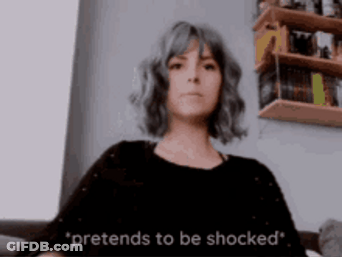 Pretty Fashionable Lady Pretends To Be Shocked GIF