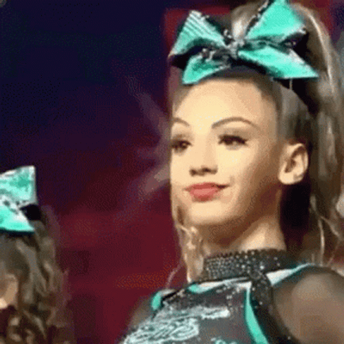 Pretty Girl In Front Giving Mean Mug GIF
