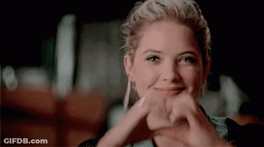 Pretty Lady Shows Moving Heart Hands GIF