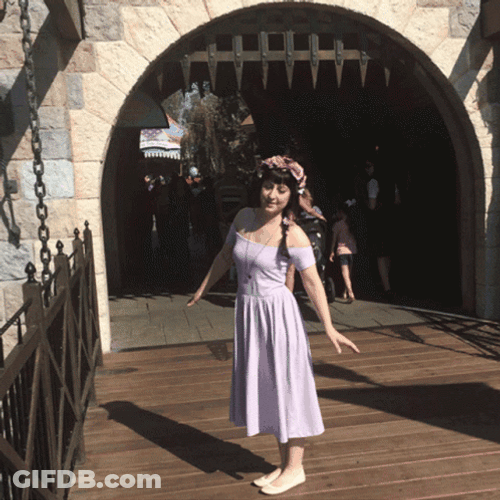 Pretty Lady Twirls In Disneyland GIF