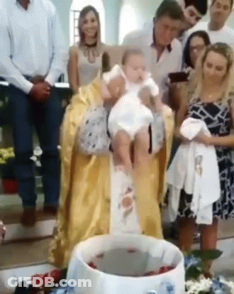 Priest Holding Baby At Baptism GIF