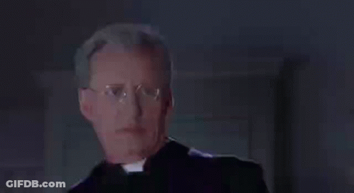 Priest Wearing Glasses And Purple Vest GIF