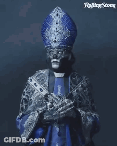 Priest With Mask Holding Cross GIF