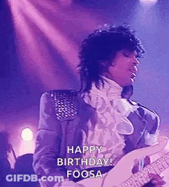 Prince Is Playing A Guitar On Stage And Saying Happy Birthday . GIF