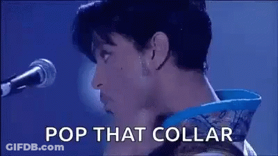 Prince Is Singing Into A Microphone With The Words Pop That Collar . GIF
