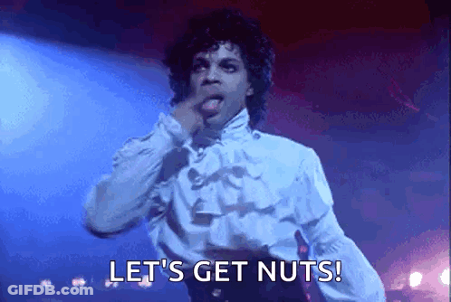 Prince Is Singing On Stage And Says Let 'S Get Nuts ! GIF
