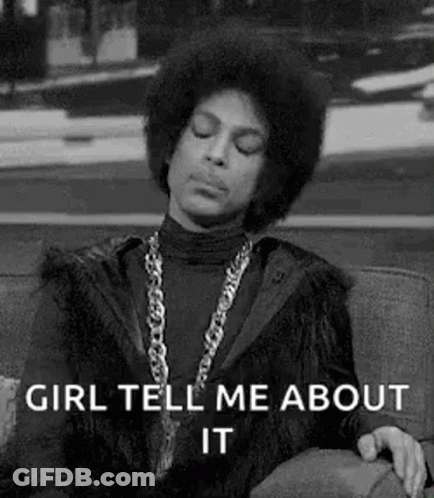 Prince Is Sitting On A Couch With His Eyes Closed And A Necklace Around His Neck . GIF