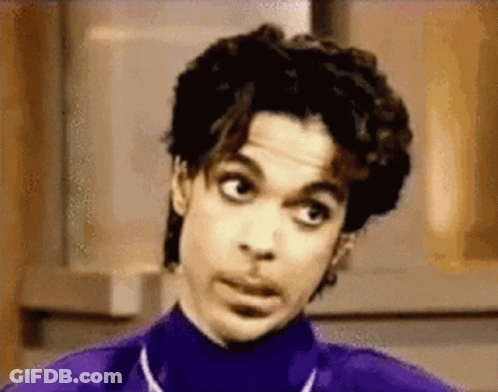 Prince Is Wearing A Purple Turtleneck And Making A Funny Face GIF