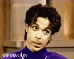 Prince Is Wearing A Purple Turtleneck And Making A Funny Face GIF