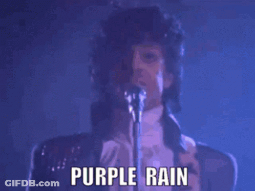 Prince Singing Into A Microphone With The Words Purple Rain Below Him GIF