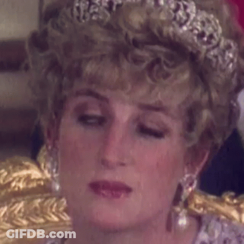 Princess Diana Is Wearing A Tiara And Earrings . GIF