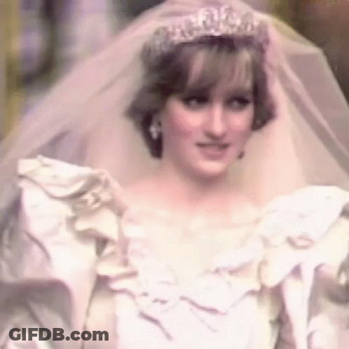 Princess Diana Is Wearing A White Wedding Dress And Veil And A Tiara . GIF
