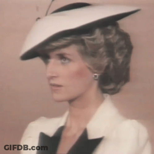 Princess Diana Wearing White Hat And Black Jacket GIF