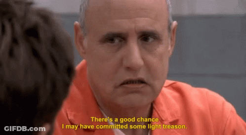 Prisoner In Orange Uniform Says Light Treason GIF