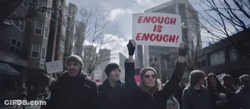 Protester Holding Enough Is Enough Sign GIF
