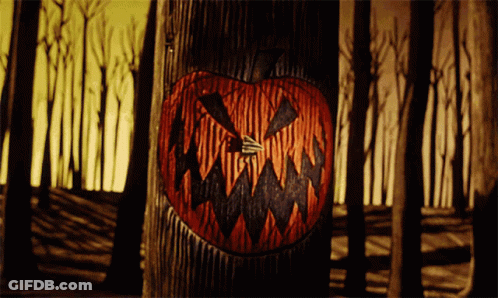 Pumpkin Painting On Tree Trunk GIF