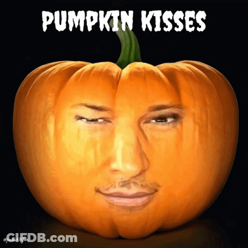 Pumpkin With Carved Man Face And Pumpkin Kisses GIF